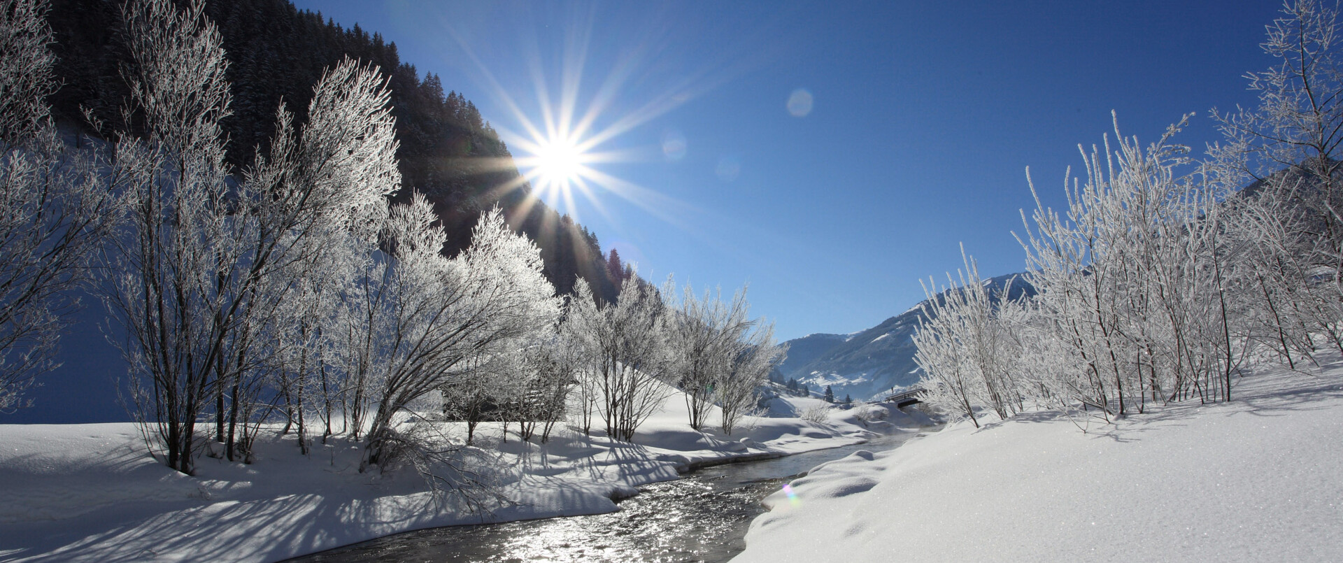 Eine tief verschneite Winterlandschaft erwartet euch im Winterurlaub im Hotel Diellehen in Großarl.